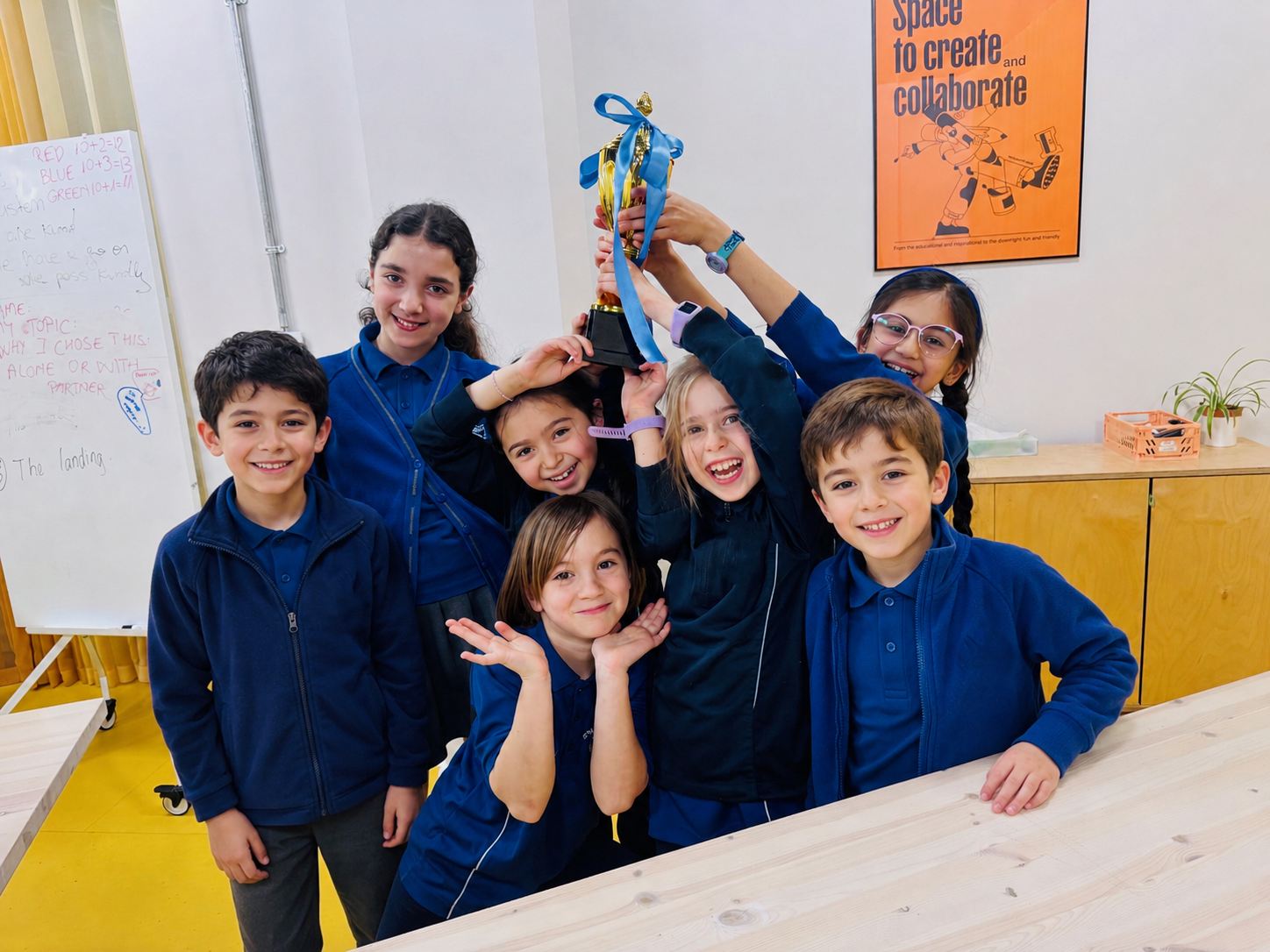 Children celebrating together at a Configur Academy session